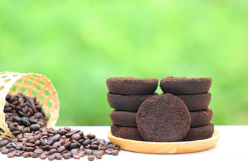 Coffee ground and Coffee beans on natural green background