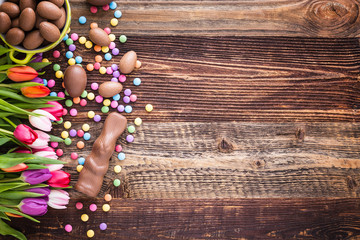 chocolate rabbit, easter eggs and tulips