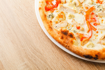 Pizza close up on a wooden table