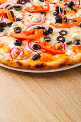 Pizza close up on a wooden table