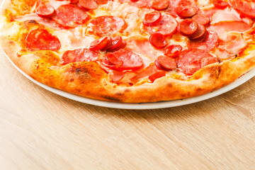 Pizza close up on a wooden table