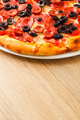 Pizza close up on a wooden table