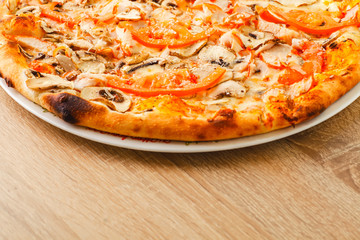 Pizza close up on a wooden table