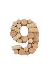 Number nine made of wine corks isolated on white