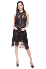 High fashion portrait of young elegant woman in a summer dress. Studio shot on white background