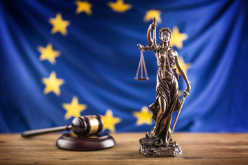 Lady Justice and European Union flag. Symbol of law and justice with EU Flag