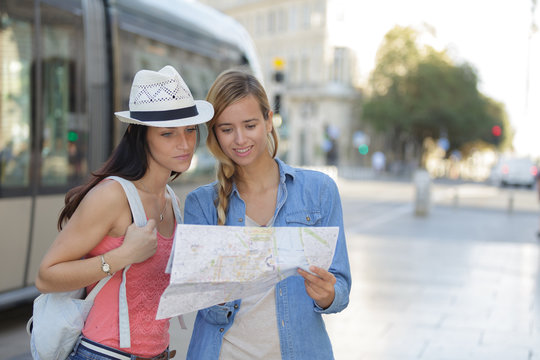 Young Beautiful Woman Travelers Exploring The City