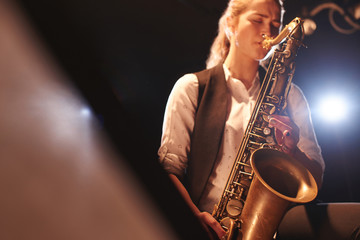 The girl playing the saxophone