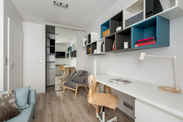 White desk, chair and bookshelves
