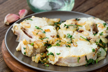 Homemade stew of hake wheels cooked in sauce