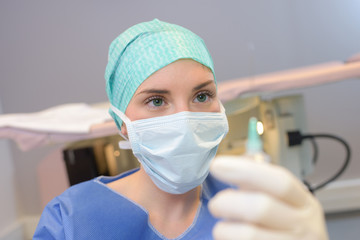 nurse preparing injection