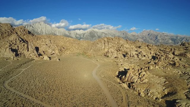 A high aerial sunset shot over the Alabama Hills outside Lone Pine California with Mt. Whitney and Sierras background.