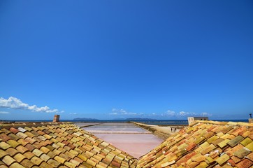 Trapani, Italy, Sicily August 20 2015. The fabulous salt pans of Trapani, with its characteristic...