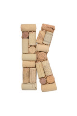 Alphabet letter K from wine corks isolated on white background