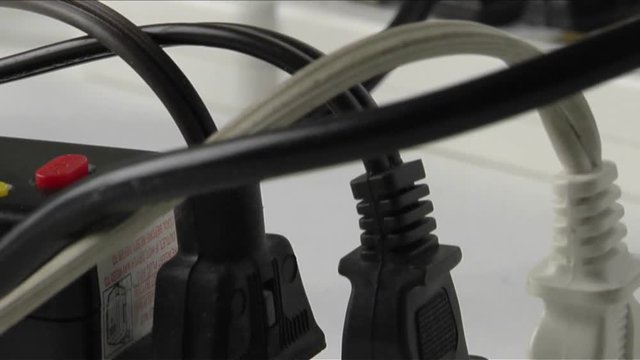 Plugs fill up surge protectors.