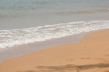 Soft wave of the blue ocean on the seashore of Thailand, copy space on the sand copy space