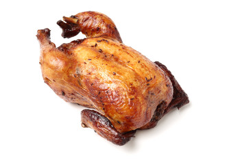 Whole roasted chicken against white background