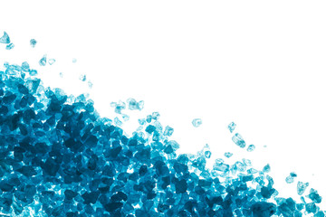 Blue crystals of sea salt on white background