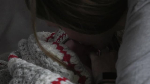 motherly instinct and kisses keep baby calm using finger as soother