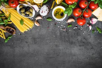 Italian Food background on black stone table. Top view.