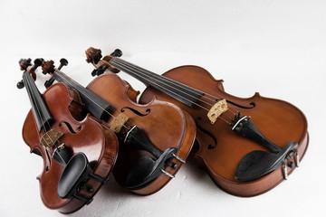 The classic violin and viola stacked on white background.warm light tone,vintage and art design