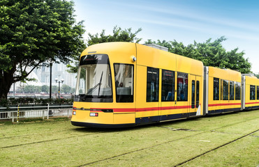 Fototapeta na wymiar Tram running on railway in Guangzhou, China