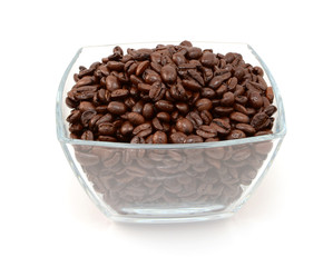 Square glass bowl full of roasted coffee beans