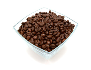 Glass bowl filled to the brim with coffee beans