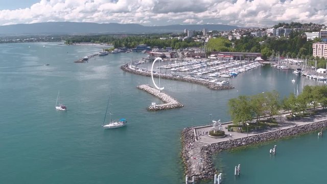 Lausanne Ouchy aerial shot - Flying over the lovely marina - with sail boats. Flying over the lovely marina - with sail boats