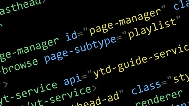 Scrolling HTML code on the computer screen on a black background