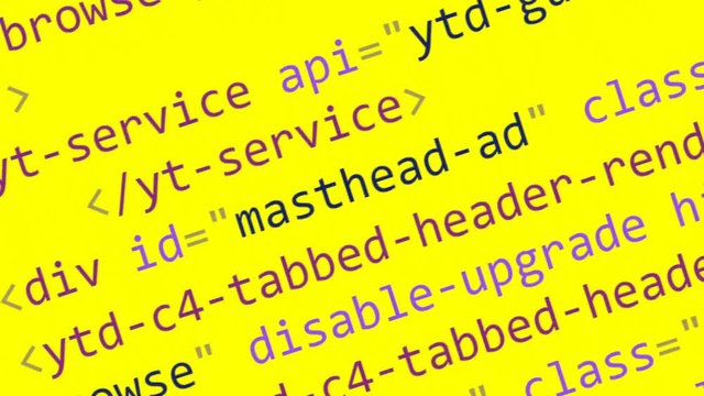 Scrolling HTML code on the computer screen on a yellow background