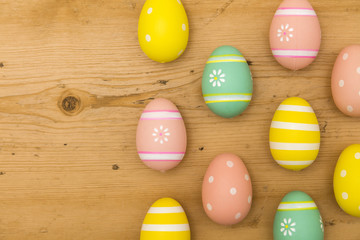Painted Easter eggs on a wooden background