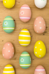 Painted Easter eggs on a wooden background