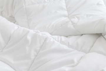 White bedding sheets background. Messy bed concept. - obrazy, fototapety, plakaty