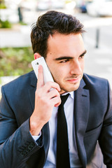 Young businessman talking on cellphone