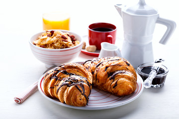Croissant with Chocolate Espresso with milk and a glass of orange juice Tradition Dry Dry with goji berries Morning Baking sweet Dessert on the White Background