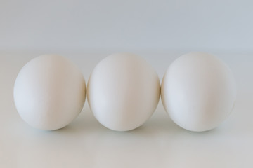Three eggs isolated on white background