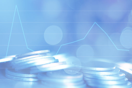 Double exposure Rows of coins of Graph on the table,finance and business concept,Money,soft focus and blurred style,dark tone.
