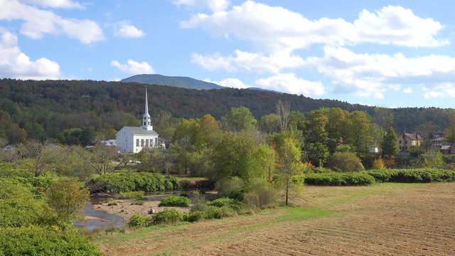 Time lapse of the church and steeple at Stowe Vermont perfectly captures small town America or New England beauty.