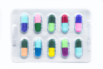 Different colorful pills medicine isolated on white background.Top view and selective focus