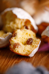 Fresh cracked cake with raisins in white glaze.