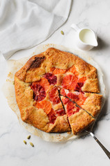Orange fruit galette and milk jug