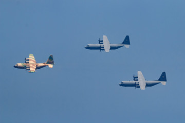 Israeli fighter jet and tanker in air refueling. The Jets flight from right to left in formation.