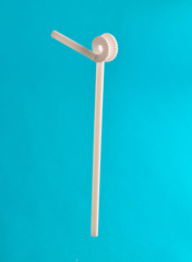 White cocktail tube on a blue background.