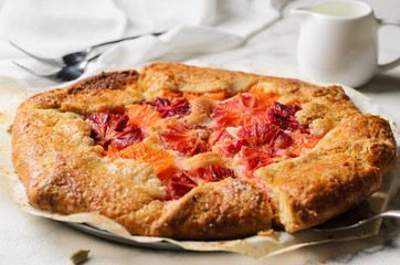 Galette with orange fruit filling and frangipane