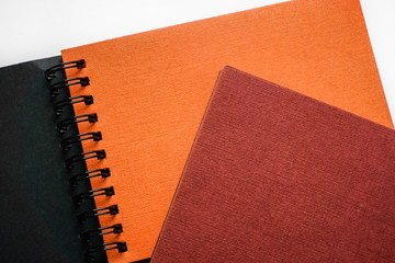  notebooks with colored orange and brown paper