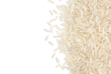 Long parboiled rice scattered on white background. Copy space for your text. Close up, top view, high resolution product. Healthy food concept