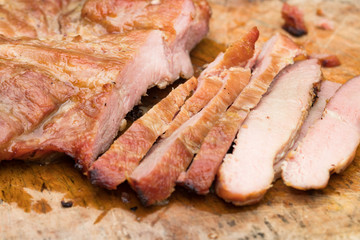 Close up tasty slice grilled pork on wooden board
