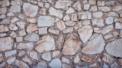 Texture. Background. Masonry light rubble stone.