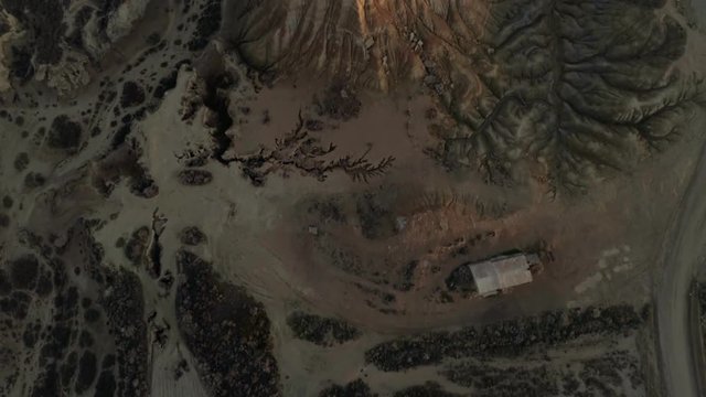 Straight down view of aerial drone footage of dry land suffering from climate change and global warming, affected by draught and water shortage, devastating effects on agriculture and nature wild life